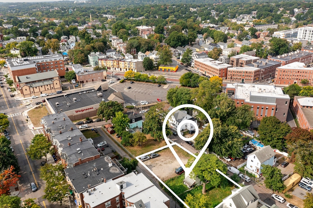 26 Notre Dame Street Boston, MA 02119 - Photo 6 of 7 an aerial view of a house with a yard