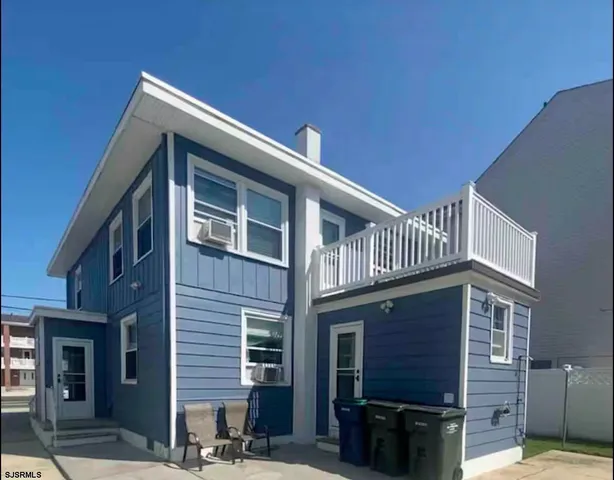 a front view of a house with stairs