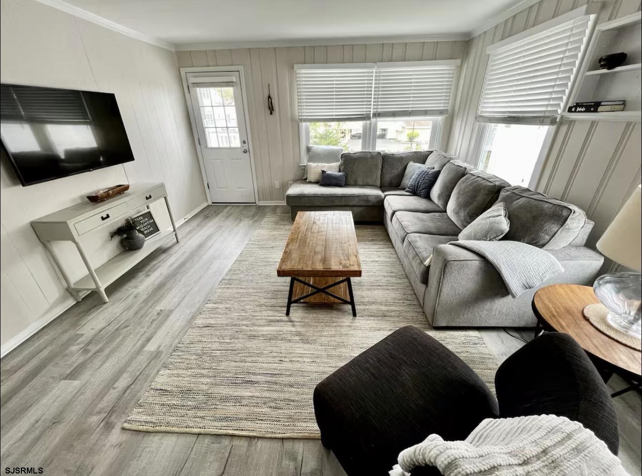 512 West Brigantine Avenue, Unit C Brigantine, NJ 08203 - Photo 3 of 19 a living room with furniture and a flat screen tv