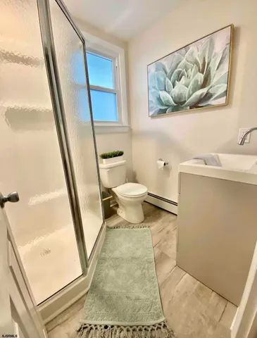 a bathroom with a toilet and a sink