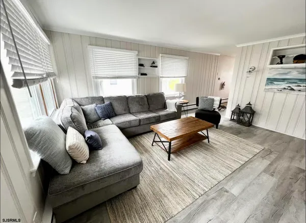 a living room with furniture and a rug