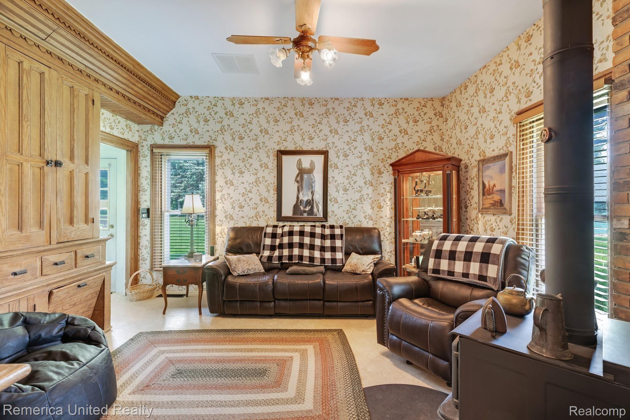 1445 East Cohoctah Road Howell, MI 48855 - Photo 28 of 64 family room with wood burning stove