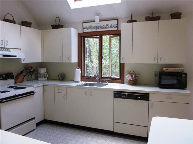 64 Day Road Wellfleet, MA 02667 - Photo 11 of 24 a kitchen with cabinets appliances a sink and a window