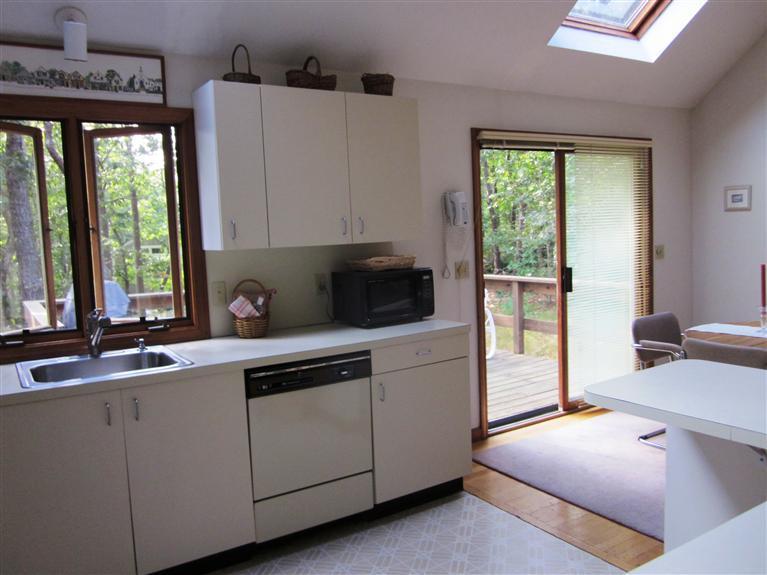 64 Day Road Wellfleet, MA 02667 - Photo 12 of 24 a kitchen with a cabinets and white appliances