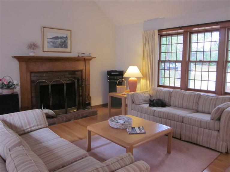 64 Day Road Wellfleet, MA 02667 - Photo 3 of 24 a living room with furniture a fireplace and window