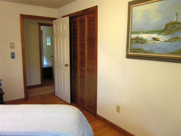 64 Day Road Wellfleet, MA 02667 - Photo 8 of 24 a bedroom with a bed and bathroom