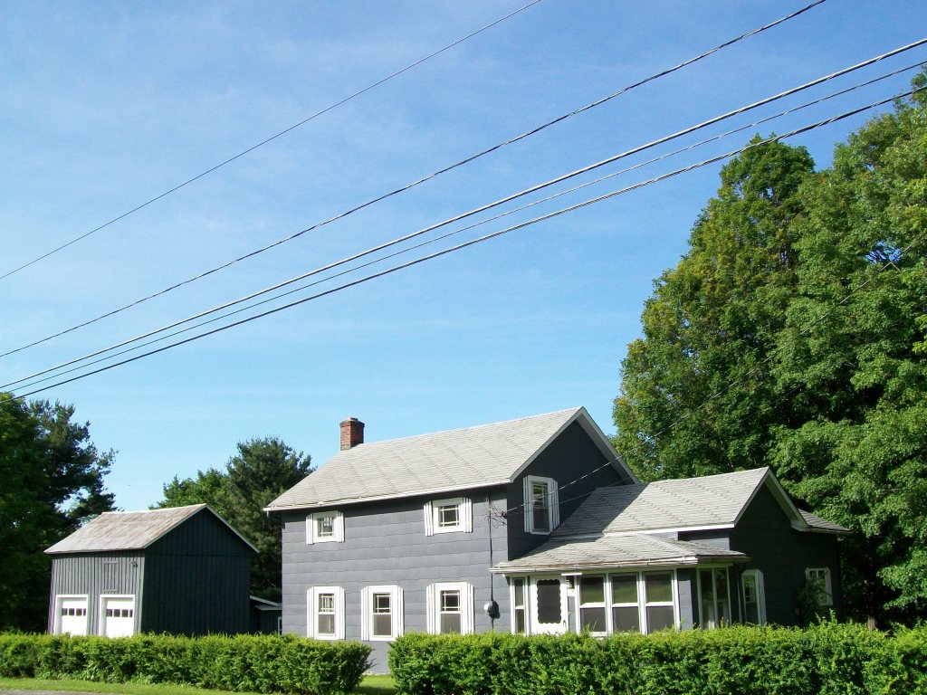 34 Albany Road West Stockbridge, MA 01266 - Photo 1 of 34 a front view of a house with plants and trees