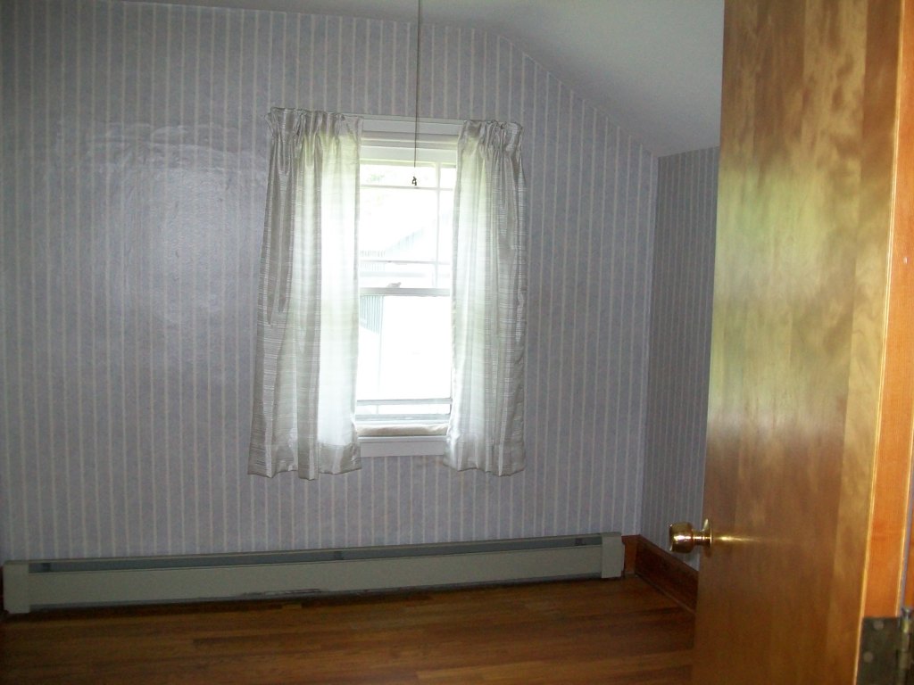 34 Albany Road West Stockbridge, MA 01266 - Photo 28 of 34 an empty room with wooden floor and a window