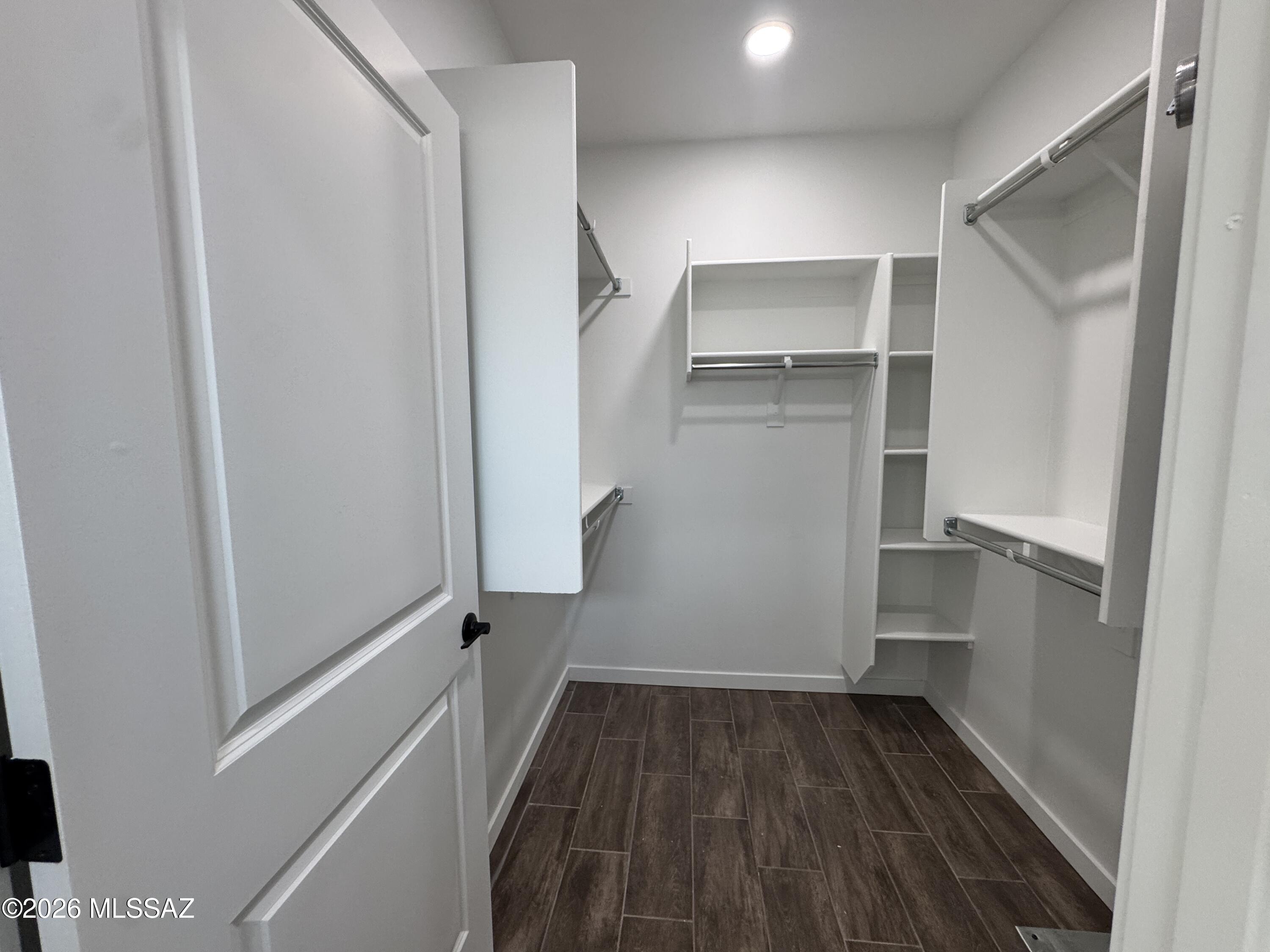2122 North Ralph Avenue, Unit 1 Tucson, AZ 85712 - Photo 9 of 10 a view of walk in closet with empty racks