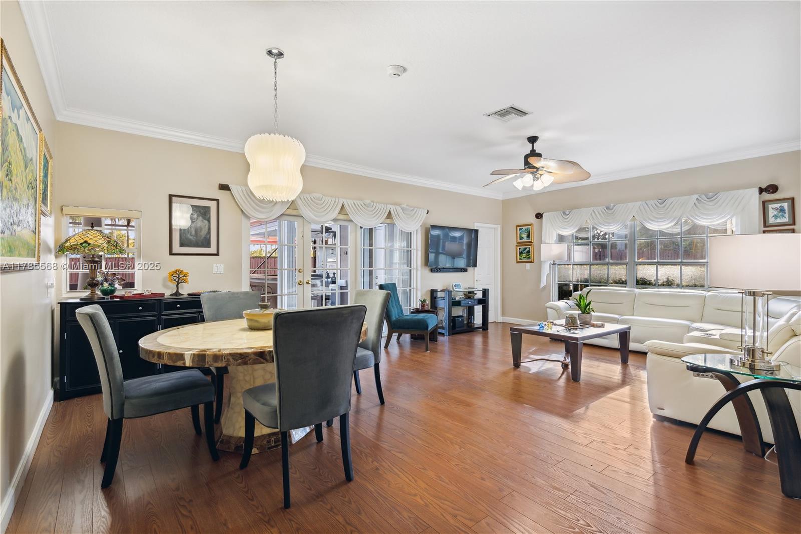 16634 Golfview Drive Weston, FL 33326 - Photo 11 of 29 a view of a dining room with furniture window and wooden floor