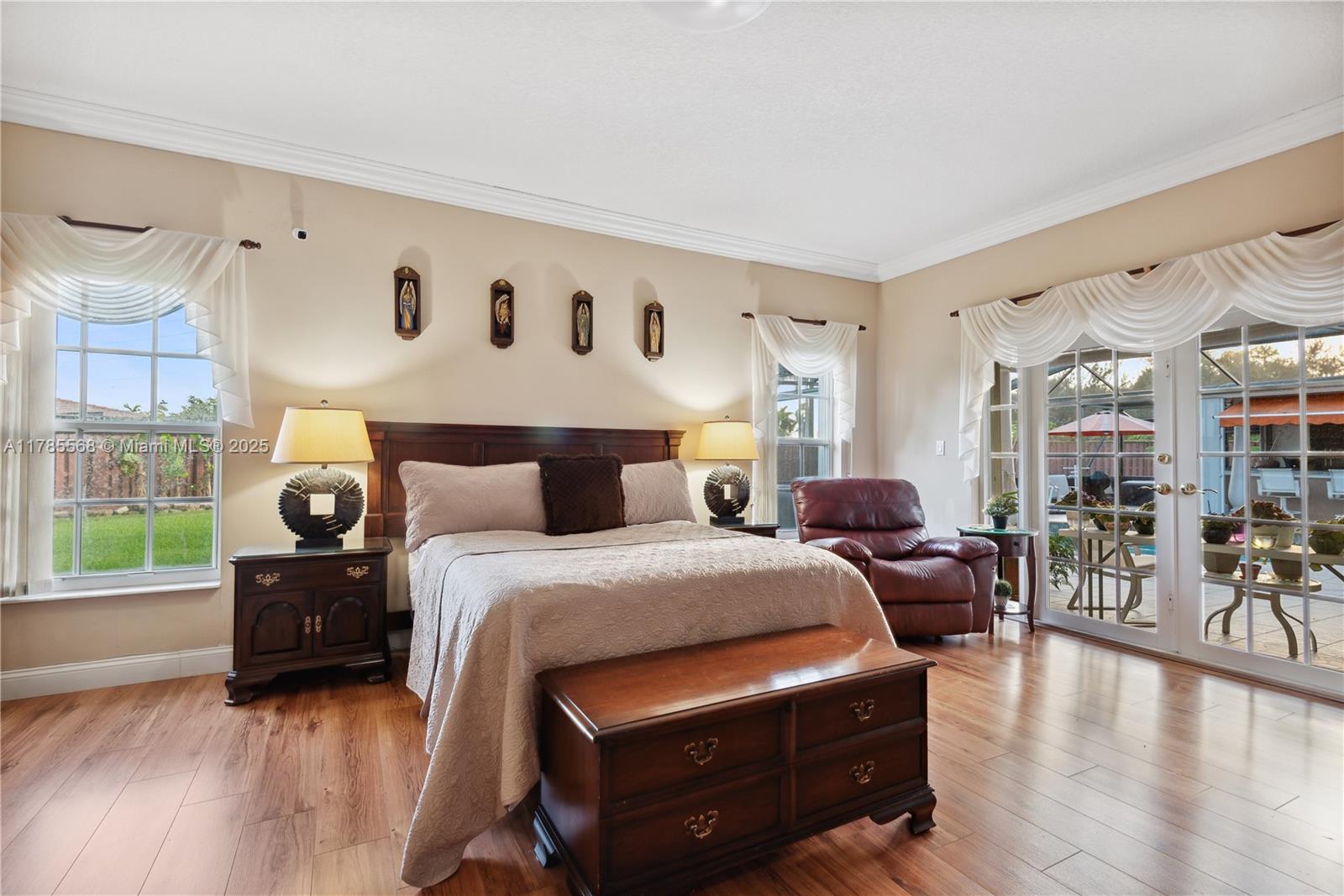 16634 Golfview Drive Weston, FL 33326 - Photo 13 of 29 a bed room with bed and a large window