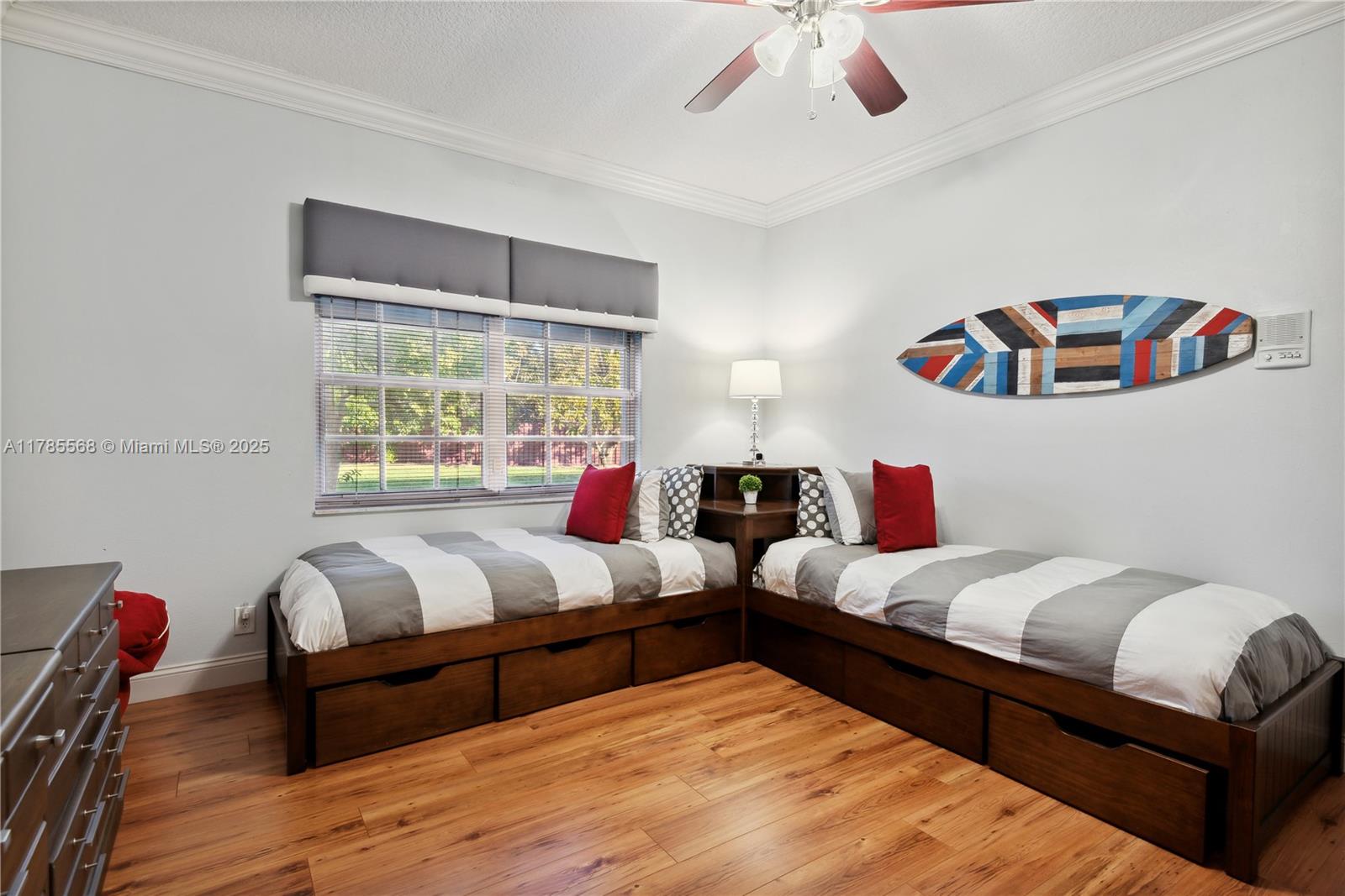 16634 Golfview Drive Weston, FL 33326 - Photo 18 of 29 a bedroom with two beds and a large window