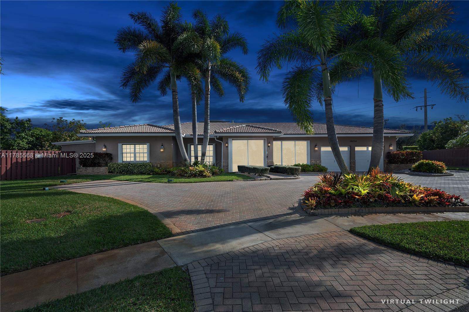 16634 Golfview Drive Weston, FL 33326 - Photo 2 of 29 a front view of a house with garden and porch