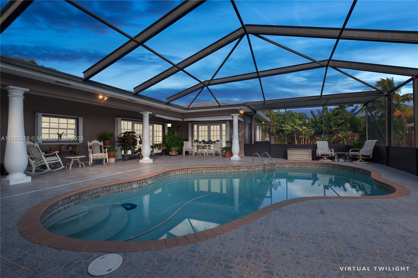 16634 Golfview Drive Weston, FL 33326 - Photo 24 of 29 a view of patio with table and chairs under an umbrella