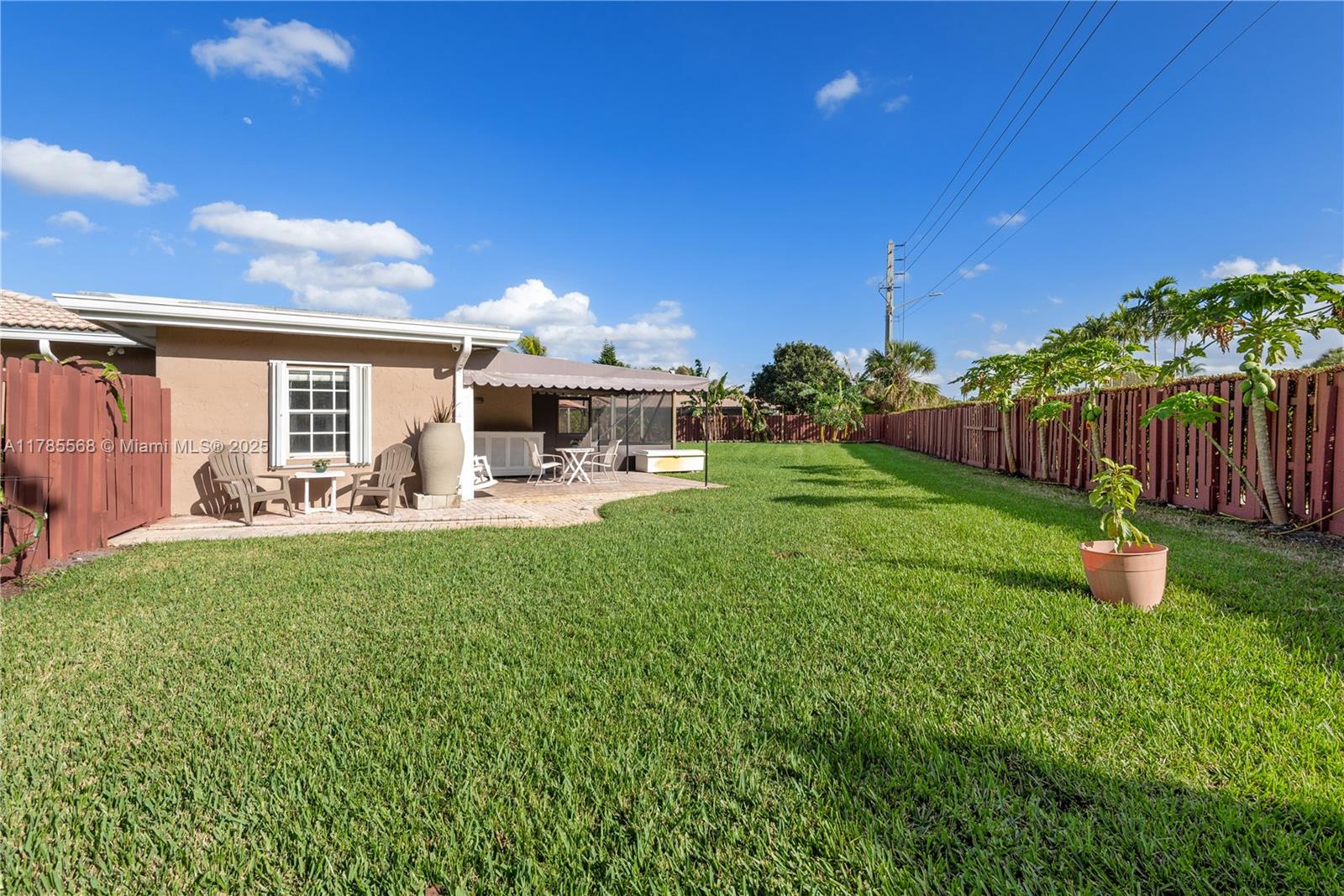 16634 Golfview Drive Weston, FL 33326 - Photo 26 of 29 a view of a backyard with a garden and plants