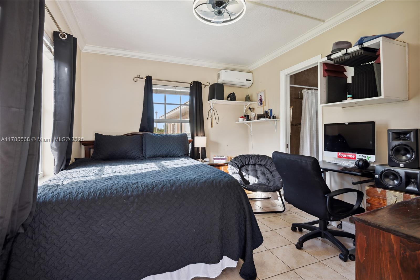 16634 Golfview Drive Weston, FL 33326 - Photo 27 of 29 a bedroom with a bed and a flat screen tv