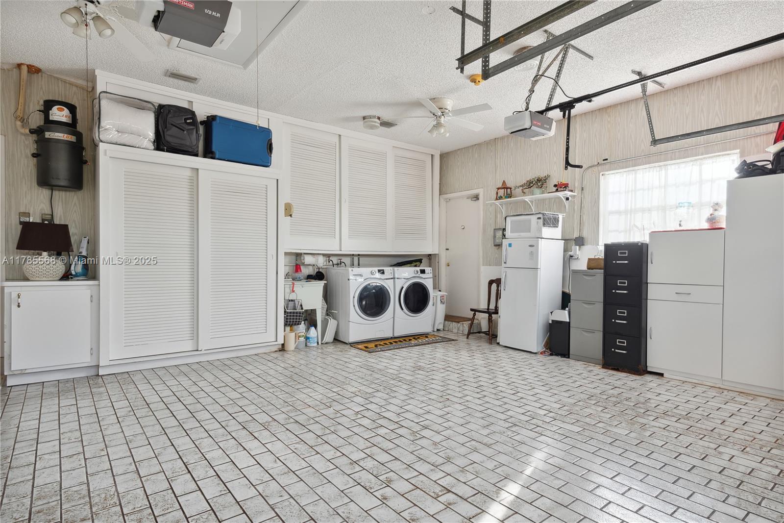 16634 Golfview Drive Weston, FL 33326 - Photo 29 of 29 a view of a storage & utility room with refrigerator