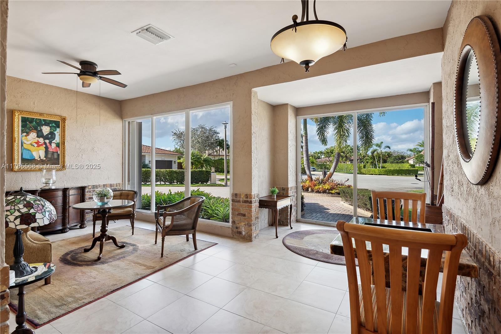 16634 Golfview Drive Weston, FL 33326 - Photo 4 of 29 a living room with furniture and a large window