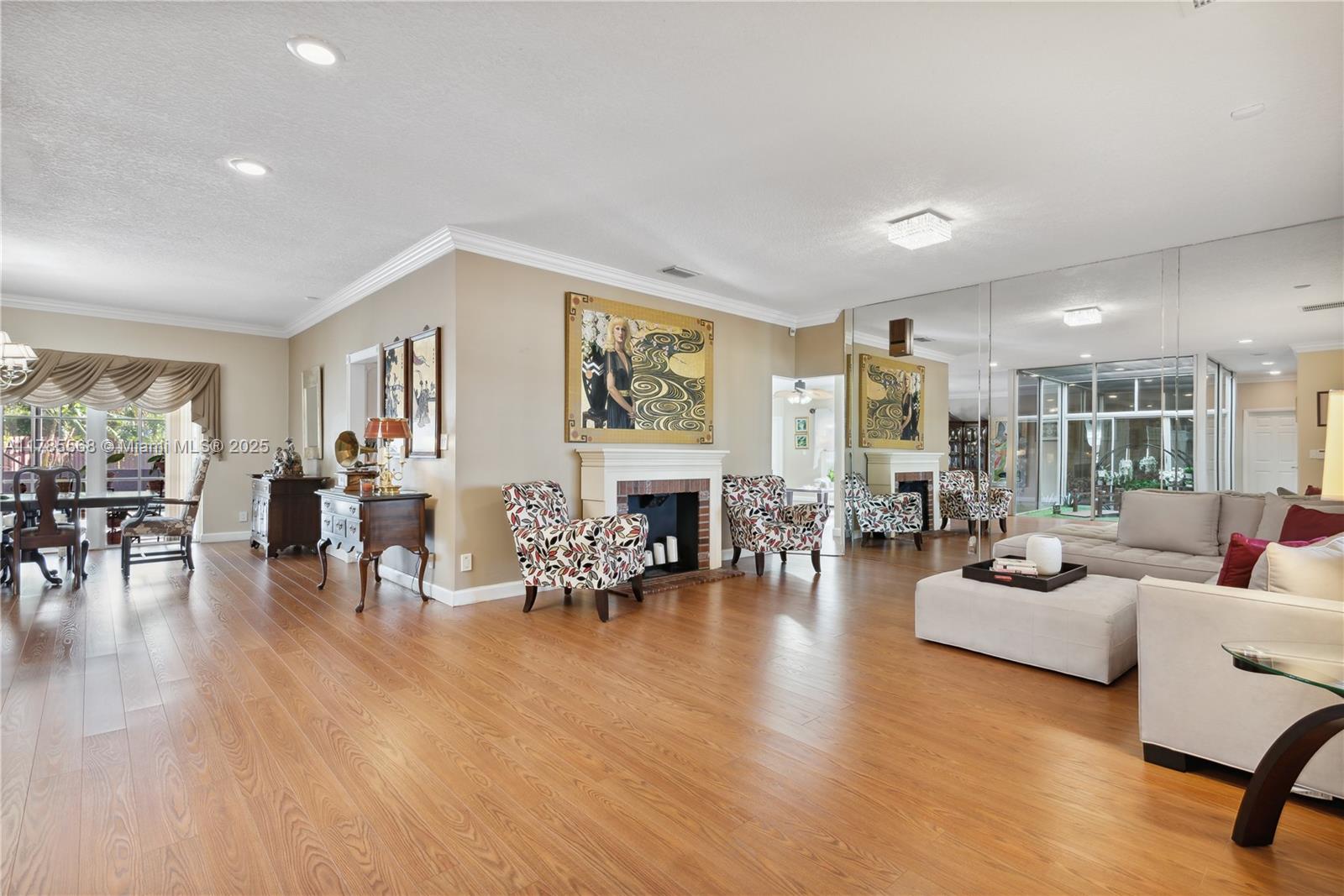 16634 Golfview Drive Weston, FL 33326 - Photo 6 of 29 a living room with fireplace furniture and wooden floor