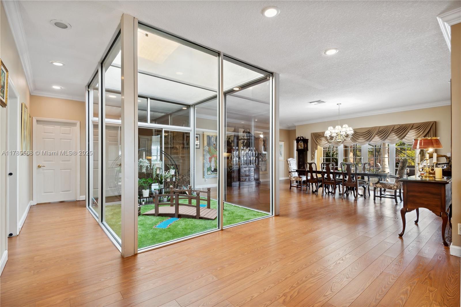 16634 Golfview Drive Weston, FL 33326 - Photo 10 of 29 a lobby with furniture and wooden floor