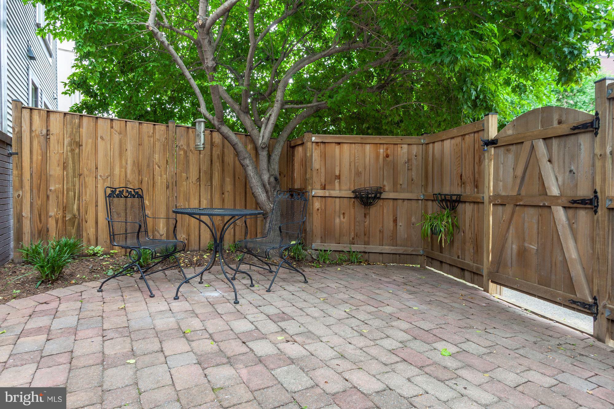 625 Ellen Wilson Place Southeast Washington, DC 20003 - Photo 17 of 26 a backyard of a house with chairs and a fence