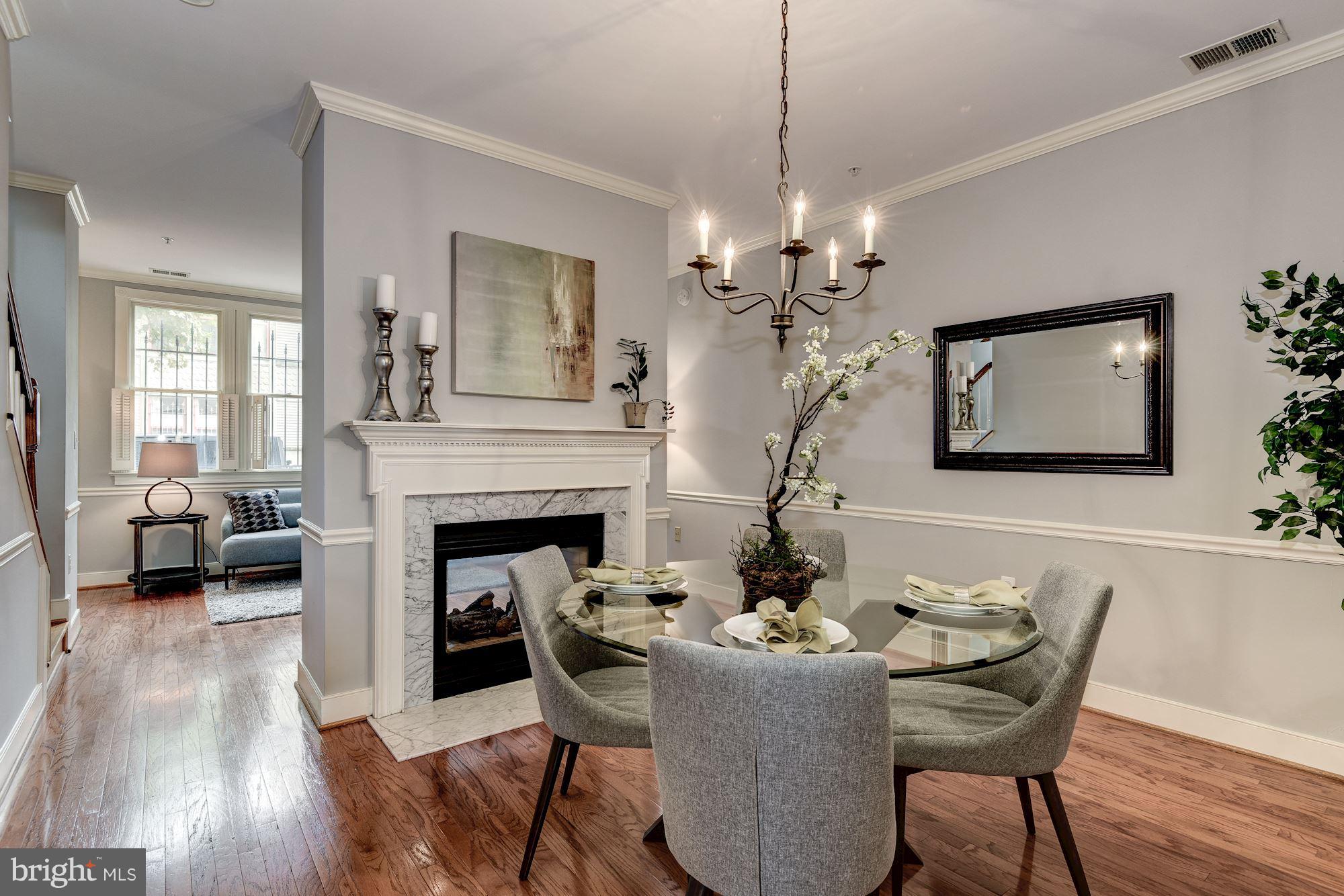 625 Ellen Wilson Place Southeast Washington, DC 20003 - Photo 3 of 26 a view of a dining room with furniture wooden floor and chandelier