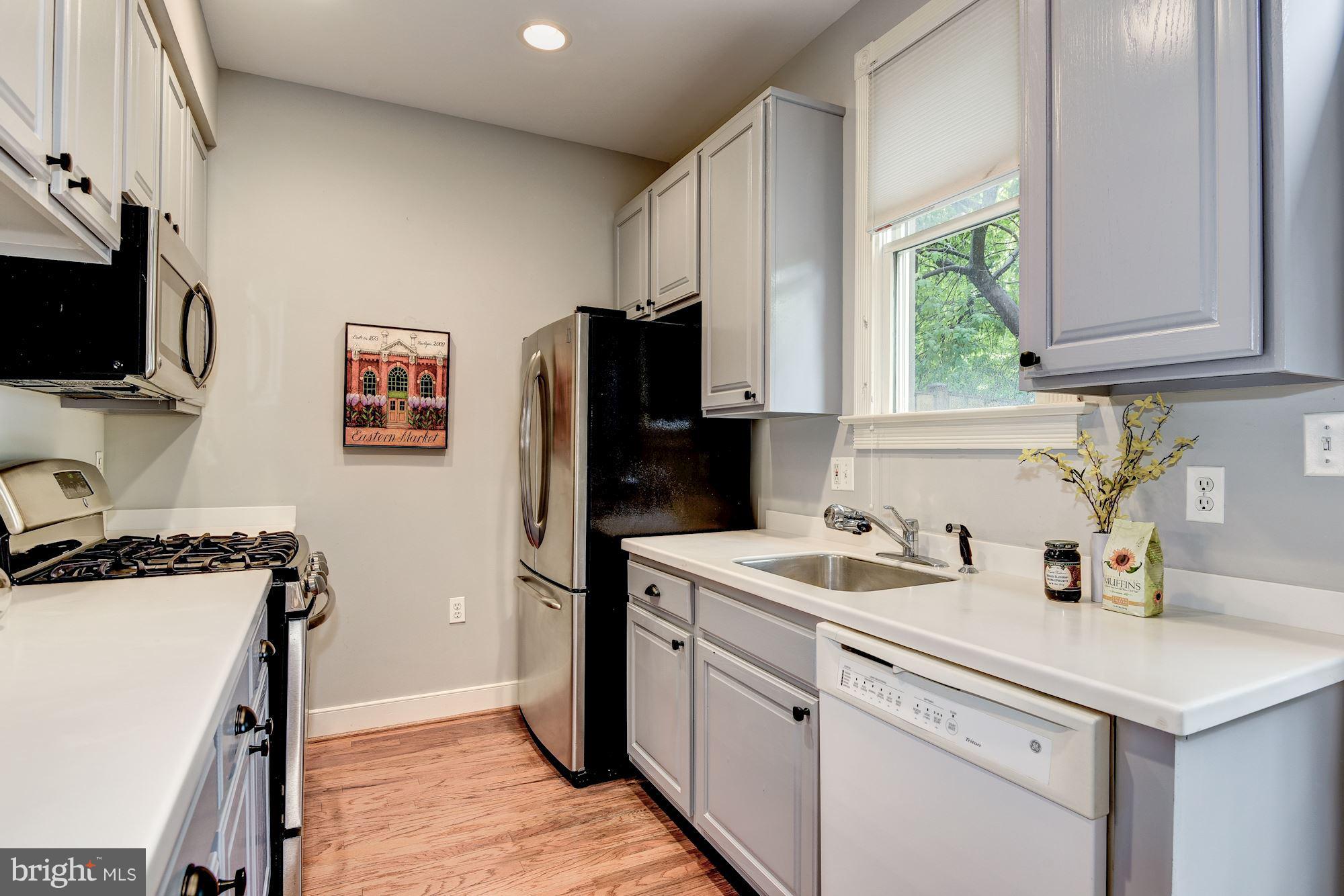 625 Ellen Wilson Place Southeast Washington, DC 20003 - Photo 8 of 26 a kitchen with a sink stove and refrigerator
