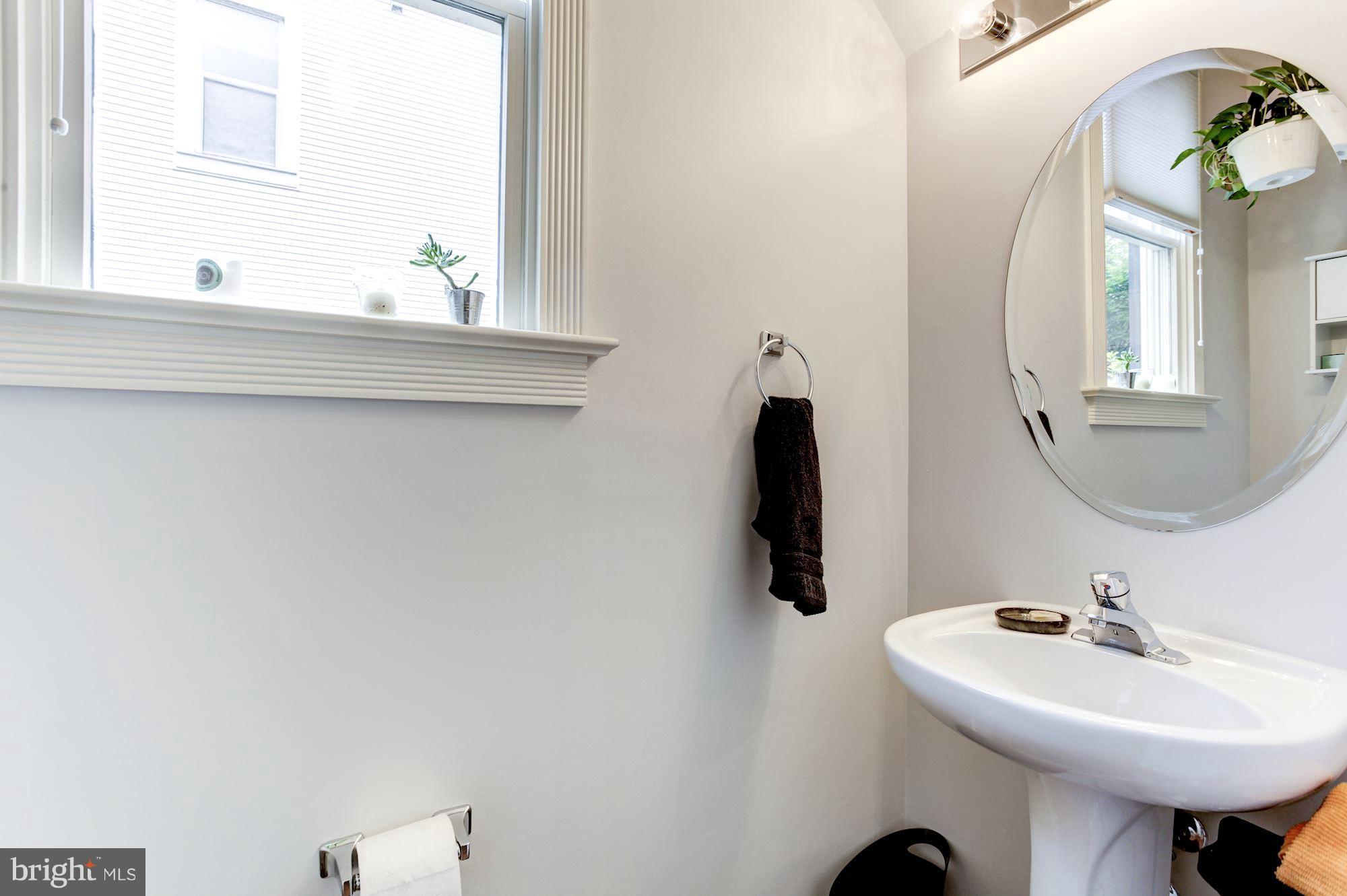 625 Ellen Wilson Place Southeast Washington, DC 20003 - Photo 9 of 26 a bathroom with a sink and a mirror