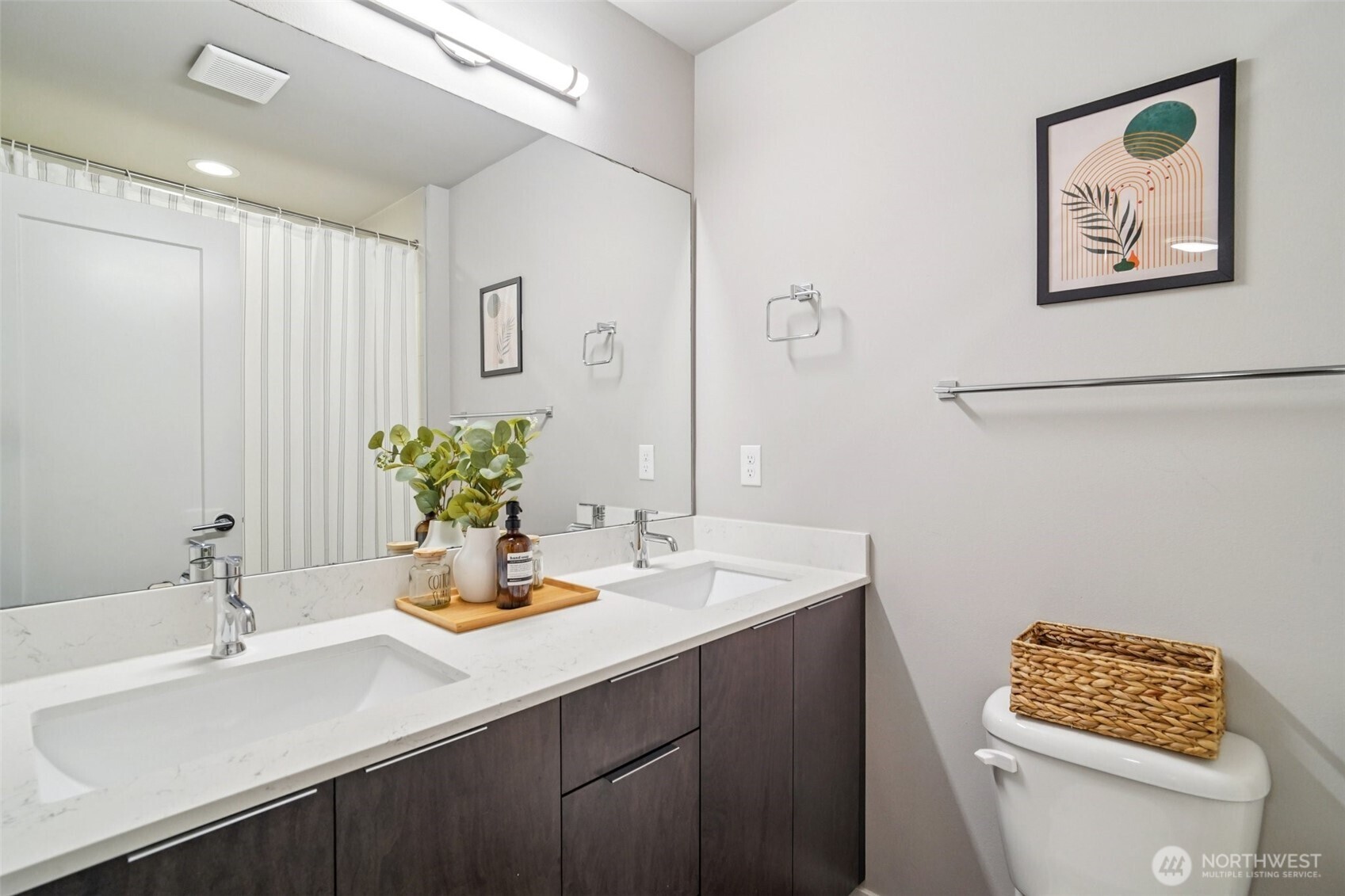 4908 South Willow Street, Unit B Seattle, WA 98118 - Photo 14 of 29 a bathroom with a sink a toilet and a mirror