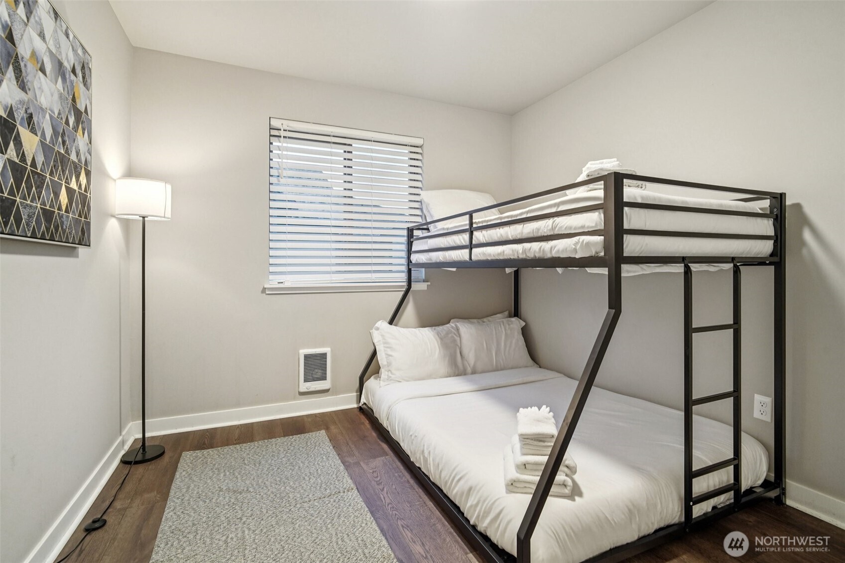 4908 South Willow Street, Unit B Seattle, WA 98118 - Photo 20 of 29 a bedroom with a bed and a mirror