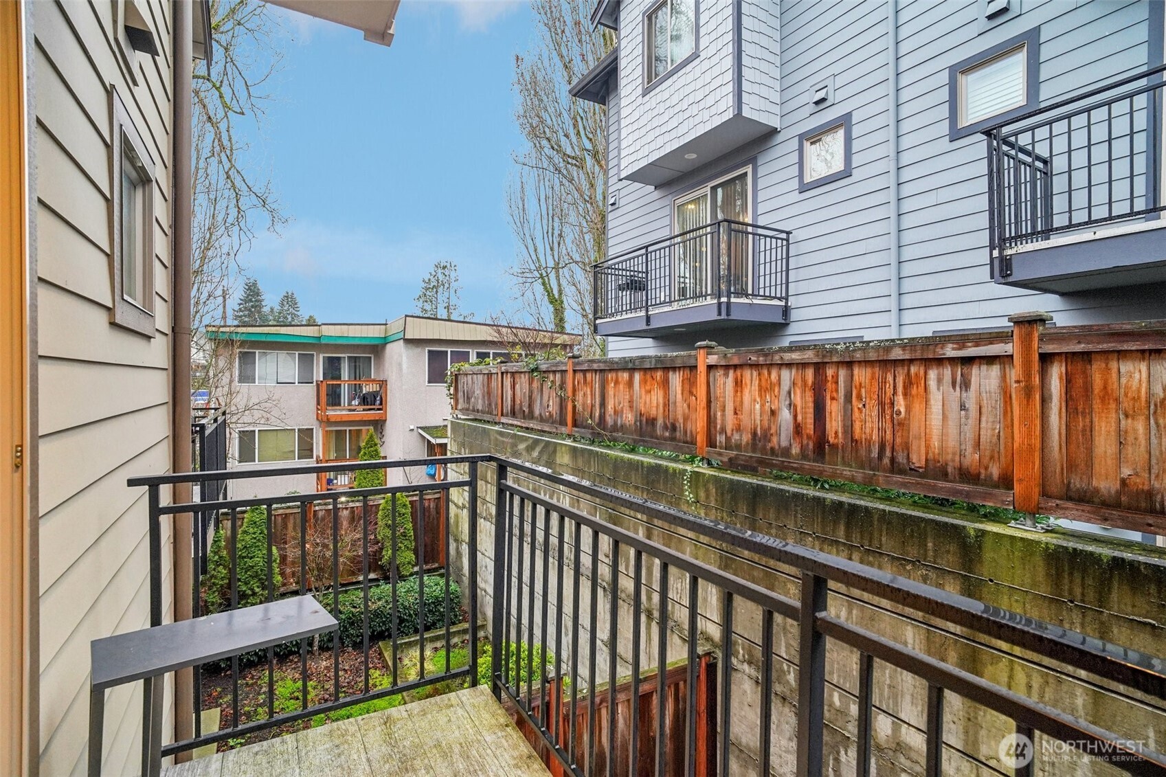 4908 South Willow Street, Unit B Seattle, WA 98118 - Photo 26 of 29 a view of a brick building from a balcony
