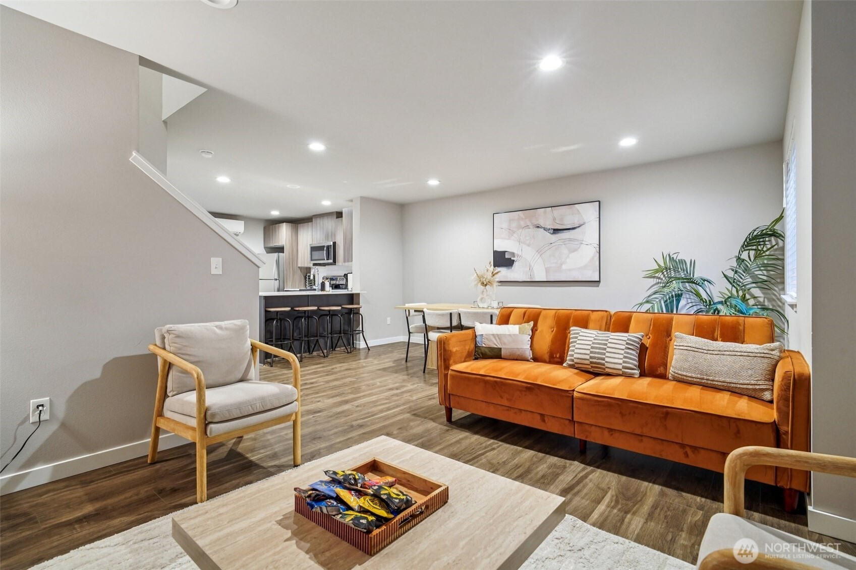 4908 South Willow Street, Unit B Seattle, WA 98118 - Photo 4 of 29 a living room with furniture and a wooden floor