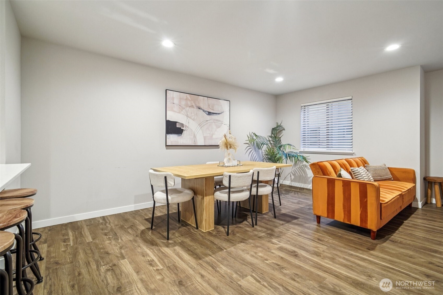 4908 South Willow Street, Unit B Seattle, WA 98118 - Photo 5 of 29 a living room with furniture and a wooden floor