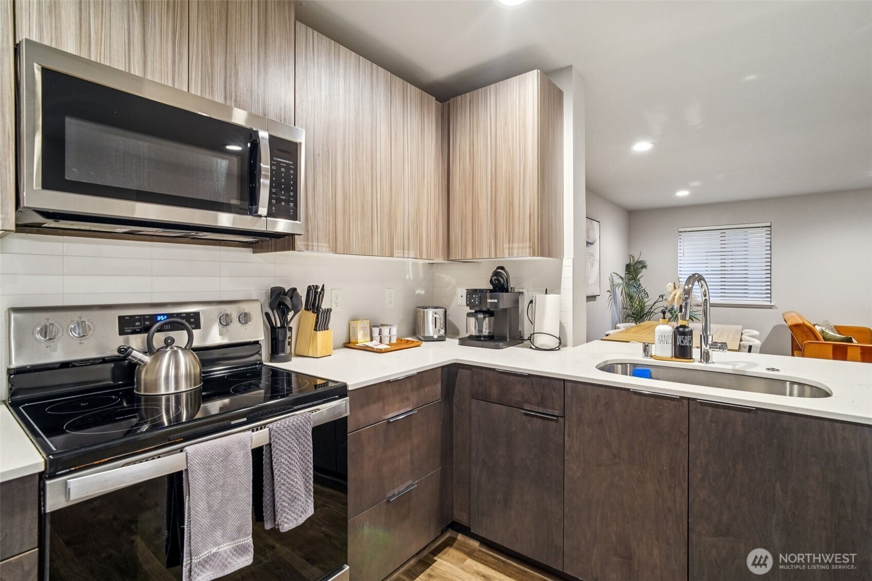 4908 South Willow Street, Unit B Seattle, WA 98118 - Photo 8 of 29 a kitchen with a sink stove and microwave