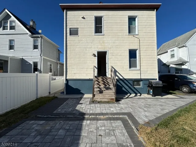 a front view of a house with large windows