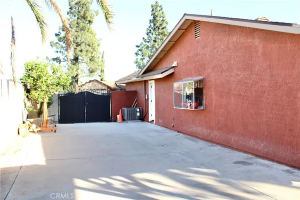 a backyard of a house with wooden fence