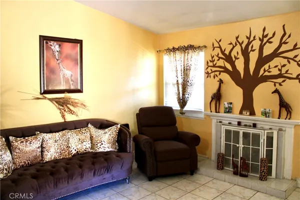 a living room with furniture and a painting