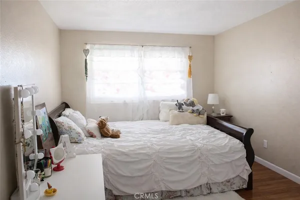 a bedroom with a bed and window