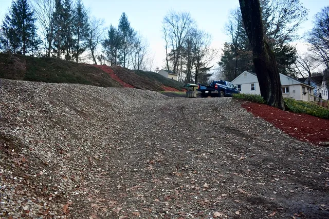 a wooden bench sitting in the middle of a forest