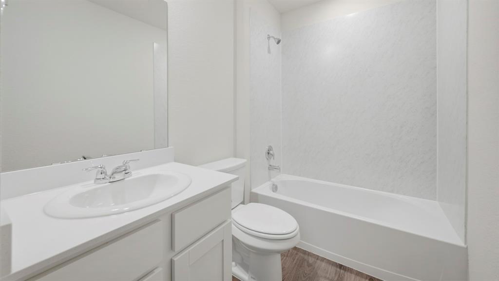 513 Wild Rose Way Princeton, TX 75407 - Photo 2 of 34 a bathroom with a sink toilet and bathtub