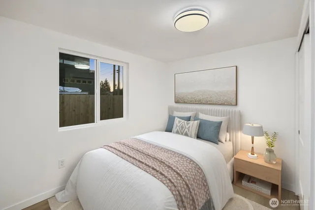 a bedroom with a bed and window