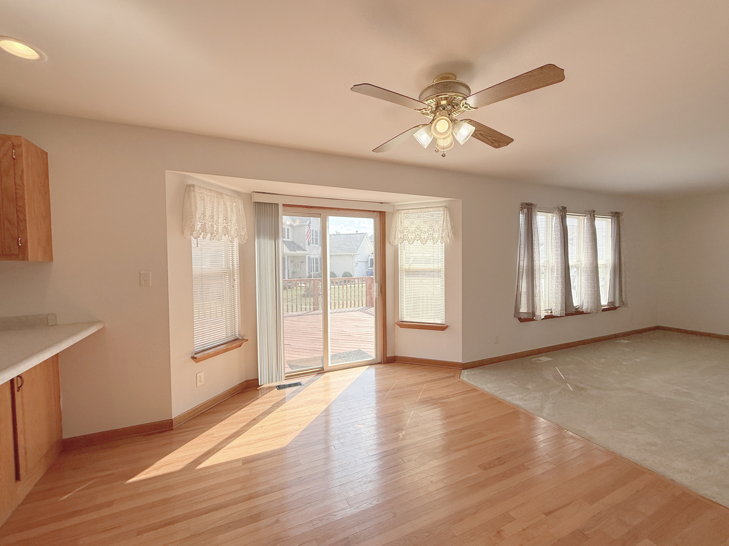 1278 Knolls Avenue South DeKalb, IL 60115 - Photo 13 of 35 a view of an empty room with a window and wooden floor