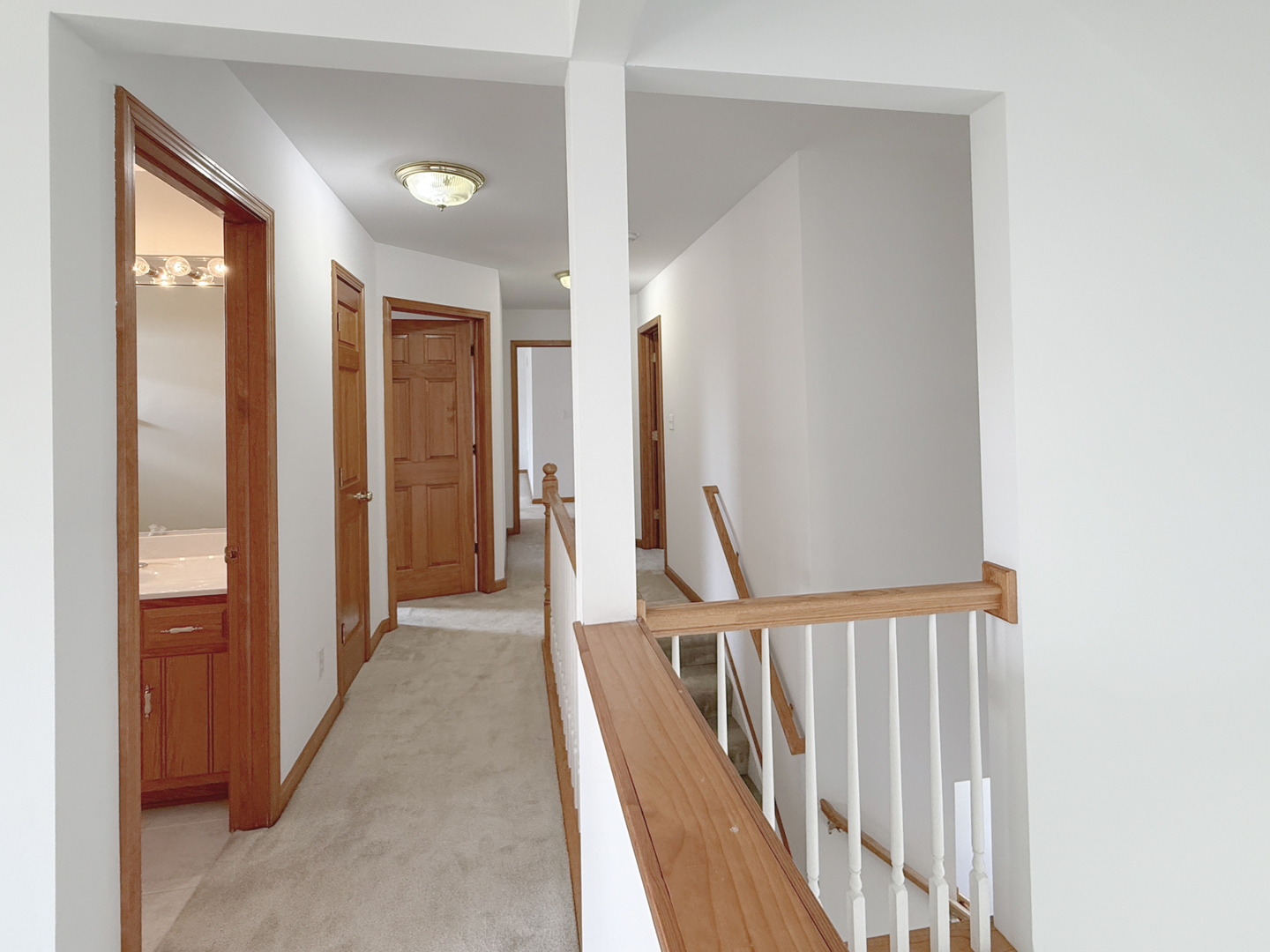 1278 Knolls Avenue South DeKalb, IL 60115 - Photo 21 of 35 a view of a hallway with wooden floor and entryway
