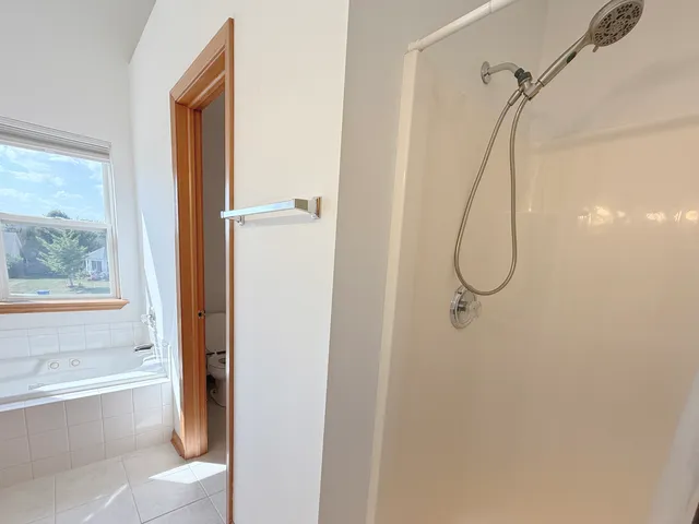 a bathroom that has a shower sink and a shower