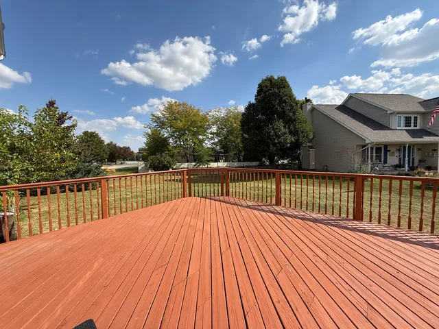 a view of balcony with wooden floor