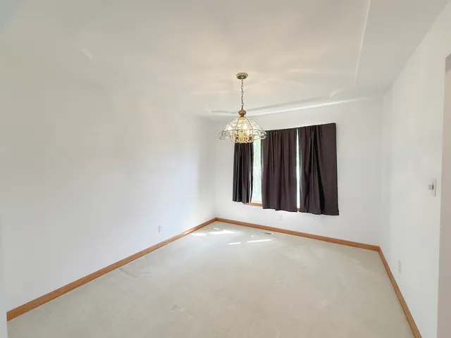 a view of a windows and chandelier in a room