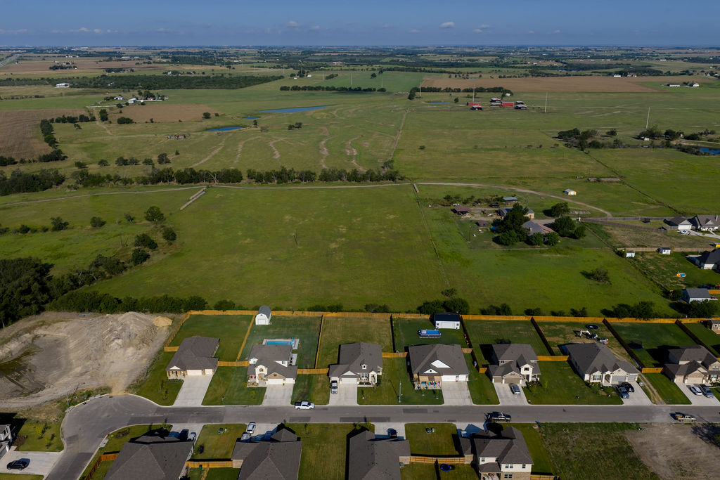 213 Gauge Road Thorndale, TX 76577 - Photo 10 of 40 an aerial view of a house with a lake view