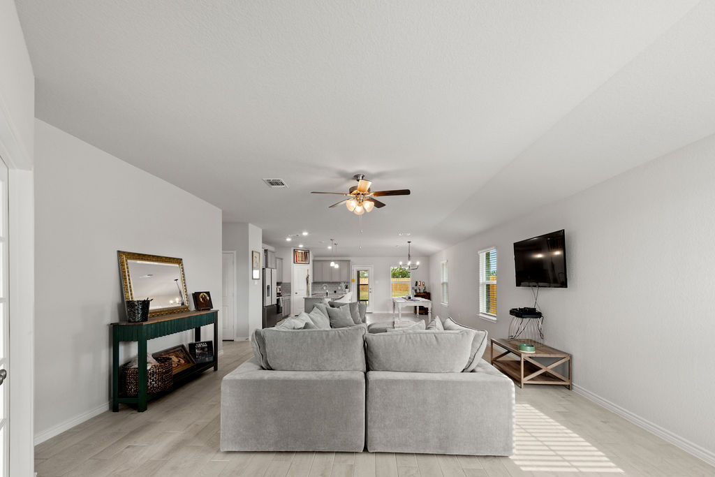 213 Gauge Road Thorndale, TX 76577 - Photo 12 of 40 a living room with furniture and a flat screen tv