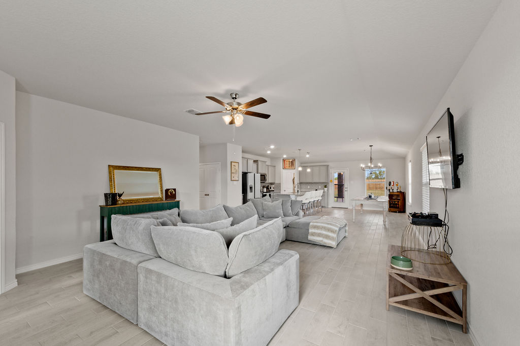 213 Gauge Road Thorndale, TX 76577 - Photo 13 of 40 a living room with furniture and a flat screen tv