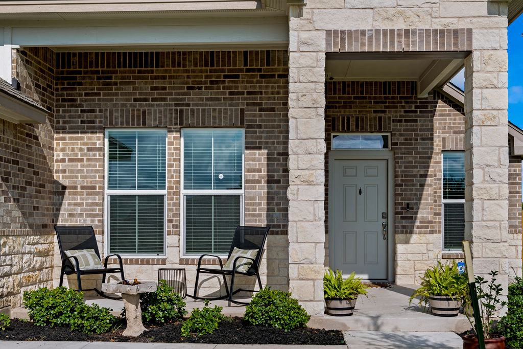 213 Gauge Road Thorndale, TX 76577 - Photo 4 of 40 a front view of a house with outdoor seating and plants
